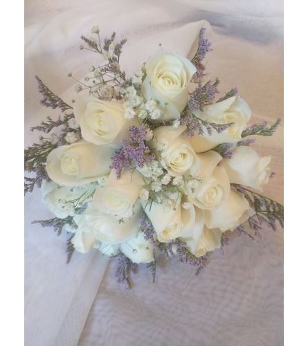 Misty Blue Bridal Bouquet. An arrangement by Avenue Flowers and Gifts.