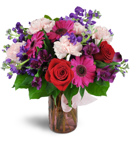My One and Only™ - Deluxe. An arrangement by Avenue Flowers and Gifts. Featuring bright pink mini gerbera daisies, delicate pink carnations,...