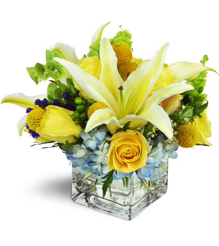 Sweet Seaside™. An arrangement by Avenue Flowers and Gifts. A beachy beauty featuring lilies, roses, hydrangea, and more arranged in a modern...