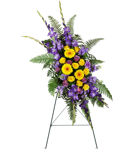 Heavenly Horizons Spray™. An arrangement by Avenue Flowers and Gifts. A peaceful combination of yellow Gerbera daisies, yellow roses, purple...