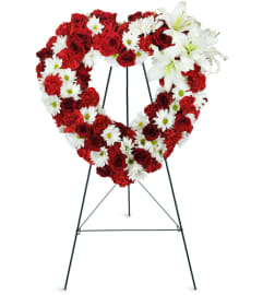 Rosy Remembrance Heart Wreath™. An arrangement by Avenue Flowers and Gifts.