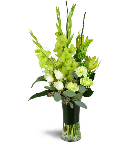 In the Limelight™. An arrangement by Avenue Flowers and Gifts. Gladiolus, carnations, Bells of Ireland, roses, protea, and more are arranged in a...