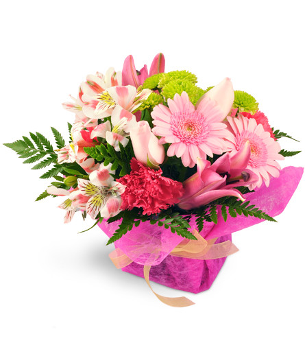 Tickled Pink. An arrangement by Avenue Flowers and Gifts. Lilies, roses, Gerbera daisies, alstroemeria, carnations, and more burst from a glass vase..