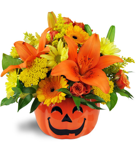 Jack O'Lovely Vase™. An arrangement by Avenue Flowers and Gifts. Lovely lilies, mini Gerbera daisies, spray roses, and daisies are arranged in a...