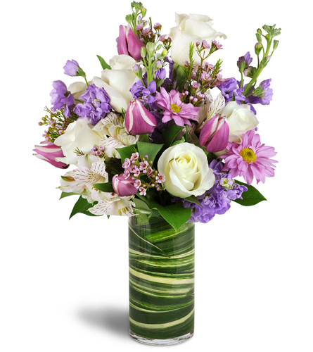 Smiling Grace™. An arrangement by Avenue Flowers and Gifts. Treat them to a graceful bouquet of roses, alstroemeria, tulips, stock, and daisies..