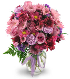 Purple Moon. An arrangement by Avenue Flowers and Gifts.