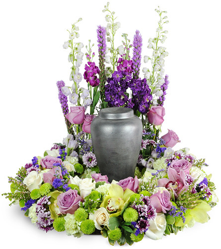 Forever Treasured. An arrangement by Avenue Flowers and Gifts. Featuring an array of orchids, roses, mums, delphinium, liatris, and more..