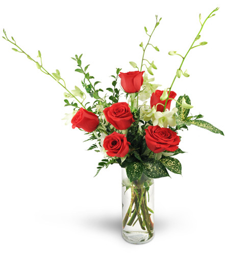 After Hours. An arrangement by Avenue Flowers and Gifts. Six red roses are arranged with three white Dendrobium orchids, oregonia, and tropical...