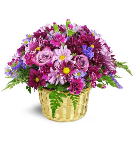 Amethyst Skies Basket™ - Deluxe. An arrangement by Avenue Flowers and Gifts. Daisies, carnations, asters, miniature carnations, and more—are...
