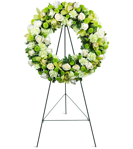 Serene Wreath. An arrangement by Avenue Flowers and Gifts. Cymbidium orchids, roses, mums, and more are beautifully arranged for display at the...